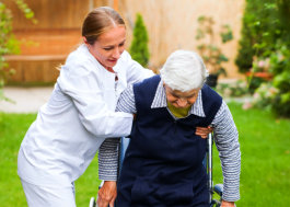 female caretaker help the elderly man