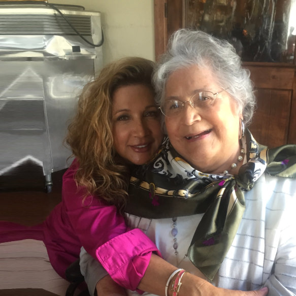 woman and elderly woman smiling