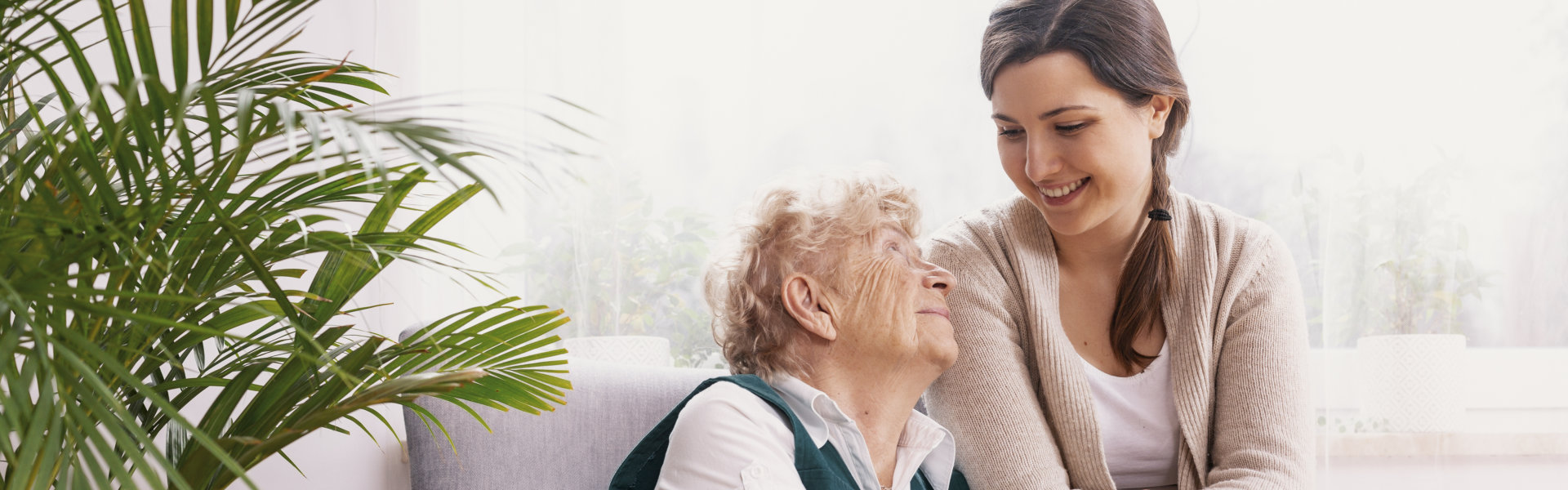 elderly lady sitting in armchair at nursing home
