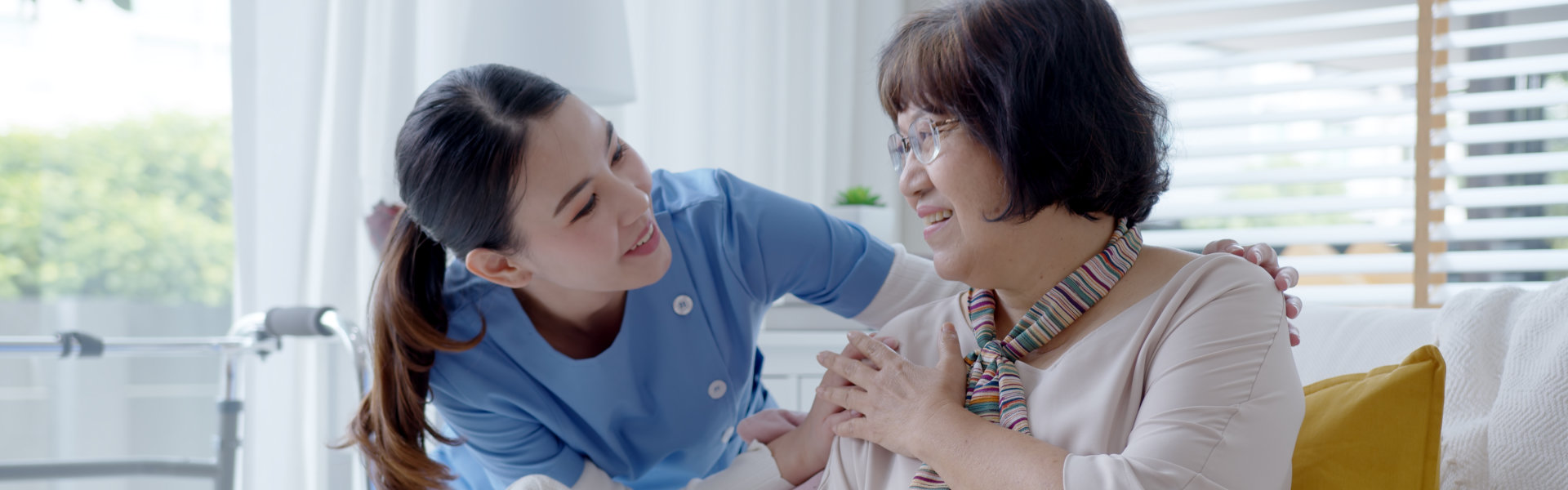 female caretaker talk to elderly woman